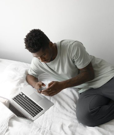 medium-shot-man-holding-smartphone